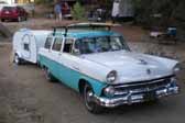 This vintage 1956 Ford Station wagon is towing a vintage teardrop trailer