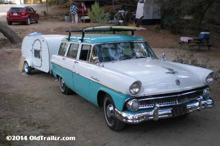 This vintage towing rig is a vintage 1956 ford country sedan pulling a vintage tear drop trailer