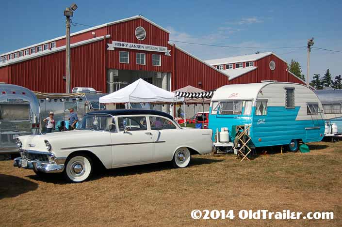 This vintage towing rig is a 1956 Chevy 150 Sedan pulling a Vintage Shasta 1500 Trailer