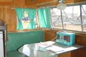 Original 1956 Shasta Trailer dining area decorated in green and white