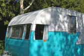 Bright 1956 Shasta 1400 Vintage Trailer ready for camping