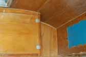 Birch wood cabinets and paneling in 1956 Shasta 1400 Travel Trailer