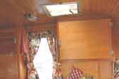 Beautifully finished birch ceiling paneling in 1956 Shasta trailer