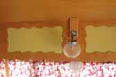 Photo of gas lighting fixture over dining table in 1956 Shasta Trailer