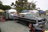 This vintage clipper trailer has a vintage 1957 chevy bel air 2 door sedan tow vehicle