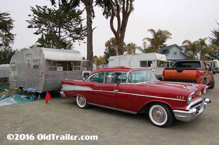This vintage towing rig is a 1957 chevy bel air 2 door coupe pulling a vintage boles aero trailer