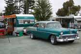 Photo shows a 1956 chevy 210 2 door sedan tow vehicle pulling a vintage 1957 jewel travel trailer