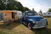 Photo of a vintage chevy pickup truck tow vehicvle pullin a vintage 1958 aloha travel Trailer