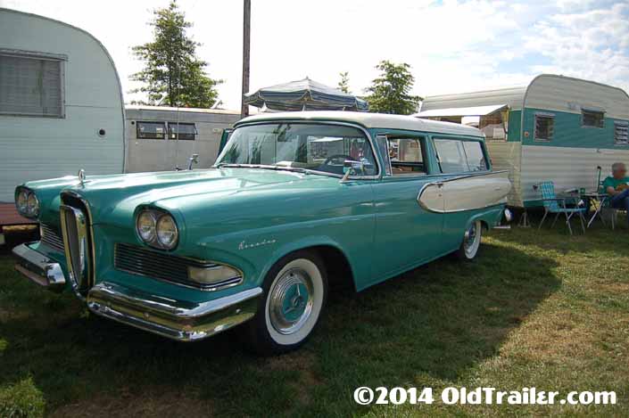 This vintage towing rig is a 1958 edsel roundup 2-door wagon pulling a vintage 1965 aloha trailer