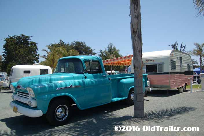 This vintage towing rig is a 1958 chevy pickup truck pulling a vintage 1958 fireball trailer
