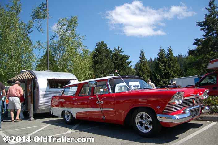 This vintage towing rig is a 1958 Plymouth Surburban Wagon pulling a Vintage Airfloat Trailer