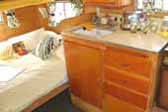 Photo of restored kitchen counter and cabinets in 1959 Shasta Airflyte Trailer
