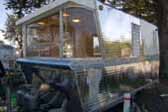 Photo of unique curved dinette windows in vintage 1960 Holiday House trailer