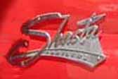 Original chrome Shasta script emblem on the side of a 1960 Shasta vintage trailer