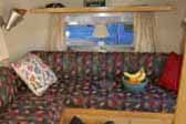 Living room & sleeping area in immaculate 1961 Airstream Bambi travel trailer