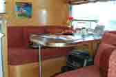Photo shows 1961 Airstream Globetrotter dining table and bench seats