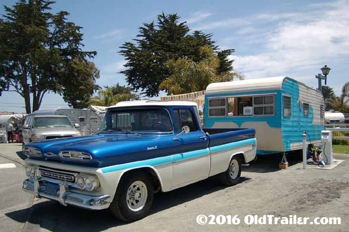 This vintage towing rig is a 1961 chevy apache pickup truck pulling a 1958 roadliner travel trailer