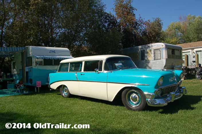 This vintage towing rig is a 1956 Chevy 210 2-door station wagon pulling a 1961 shasta 16sc travel trailer