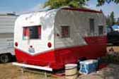 Beautifully restored 1962 Aloha 15' vintage travel trailer painted in classic red and white color scheme 