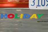 Photo of cool Holiday House graphic logo on rear end of 1962 Holiday 18-ft House trailer