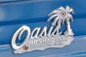 Original cast Oasis logo emblem from Donhal Inc. in Bellflower, Calif. on the side of a vintage 1962 Oasis trailer