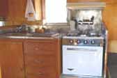 1962 Shasta Trailer with stainless steel back splash around sink and stove top
