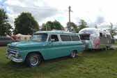 Photo shows a 1963 airstream travel trailer and 1965 chevy surburban carryall vintage tow vehicle