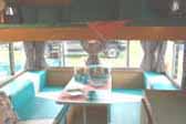Photo shows sleeping berth above dining area in 1963 Shasta Backentry Trailer