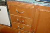 Original birch kitchen cabinets in 1963 Shasta vintage trailer