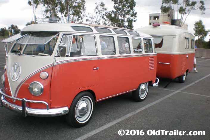 This vintage towing rig is a 1963 volkswagen 23-window samba bus pulling a vintage travel trailer
