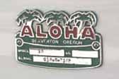 Original cast Aloha logo emblem on the side of a vintage 1966 Aloha travel trailer