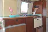 Very efficient and functional kitchen in 1968 Airstream Caravel Trailer