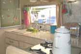 Original white washed kitchen cabinets in vintage 1968 Shasta Loflyte trailer