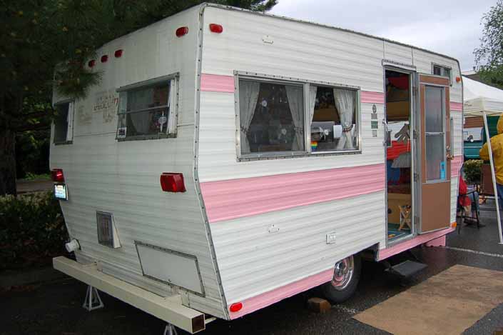 Rear view of a vintage Aladdin Trailer painted pink and white