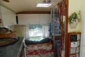 Professionally decorated bedroom area in an elegant Airstream Trailer custom camper