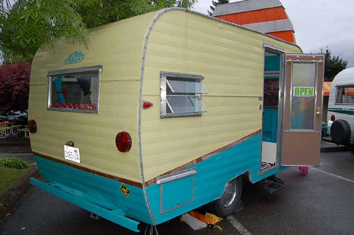 Image shows the rear end of an Aladdin Vintage Trailer at the XXX Root Beer Issaquah Trailer Rally in Washington State