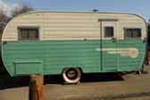 Long vintage Aljoa travel trailer camping on the California Coast