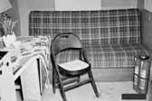 Historical photo shows the interior of a 1940's model canned ham trailer supplied by the Government, at the Hanford Trailer Camp in Washington