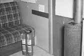 Old photo shows the interior of a 1940's model canned ham trailer supplied by the Government, at the Hanford Trailer Camp in Washington