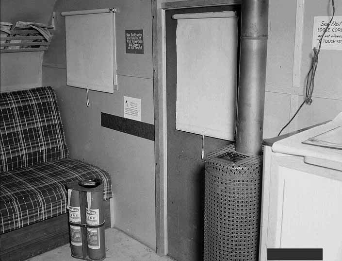 Government photo shows the interior of a 1940's model canned ham trailer supplied by the Government, at the Hanford Trailer Camp in Washington