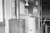 Government photo shows the interior in a 1940's model canned ham trailer supplied by the Government, at Project Hanford Trailer City in Washington