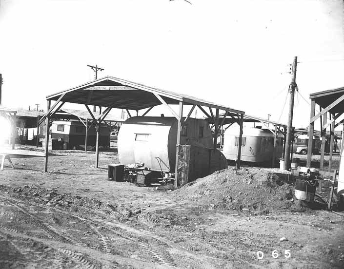 Government photo shows the worker's 1940's trailers under shade covers, at the Project Hanford Trailer City in Washington