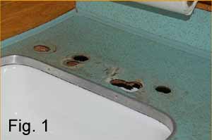 Image shows the original formica countertop with numerous holes that need to be patched and restored