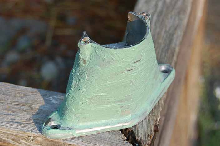 In this step we have filed off the pits in the vintage trailer license plate lamp housing and coated it with epoxy filler