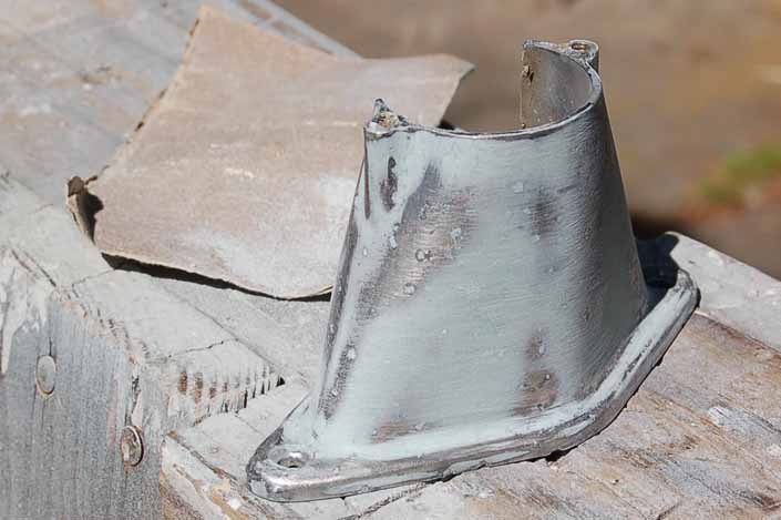 Here we're sanding the hardened exoxy filler and smoothing the surface of the vintage trailer license plate lamp housing