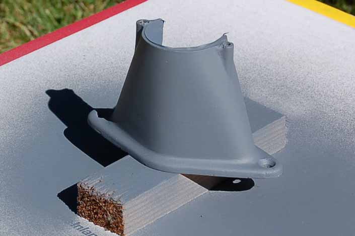 This picture shows the vintage trailer license plate light housing after the final coat of primer has been applied