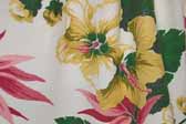 This photo shows a swatch of retro fabric with a tropical flowers on white background pattern, for your vintage trailer
