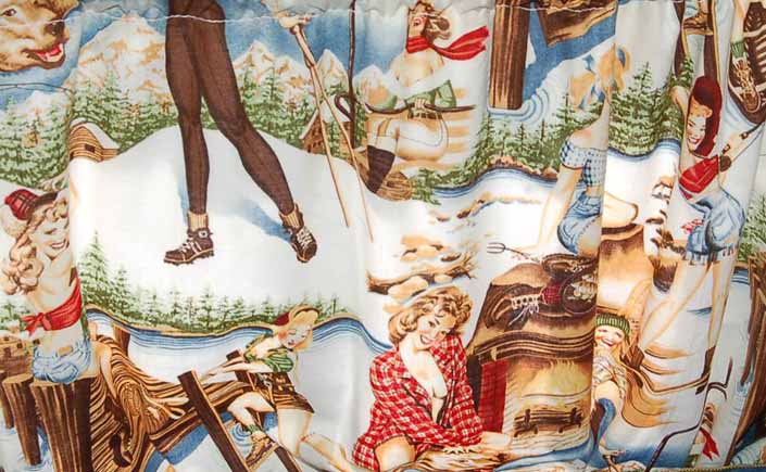 This photo shows a swatch of retro fabric with cute outdoor sports pinup girls, for your vintage trailer