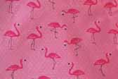 This photo shows a swatch of retro fabric with pink flamingos for your vintage trailer