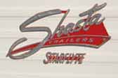 Shasta Starflyte vintage trailer with an original Shasta Starflyte cast logo emblem